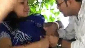 Breast oral sex in an outdoor setting