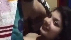 My youthful spouse indulges in explicit activities while snuggled under a blanket