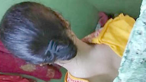 A new village bhabi gets spied on while taking a bath