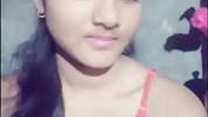 Cute girl flaunts her breasts in a seductive manner