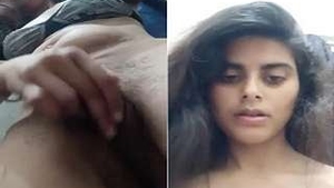 A stunning girl reveals her breasts and intimate area