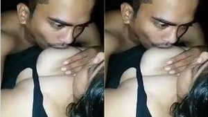 Lover fondles and sucks on girlfriend's breasts