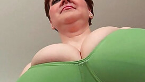 Aged BBW with massive boobs fucks a long dildo