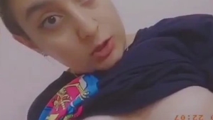 A charming Pakistani girl playfully hints and unveils