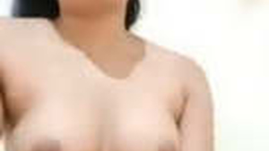 Watch a stunning Japanese woman strip down on camera