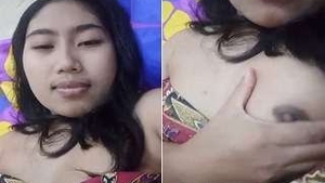 A pretty girl flaunts her breasts and pussy in a seductive manner