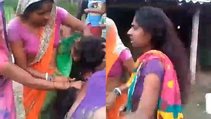 Indian sister in a heated brawl outdoors, revealing her breasts