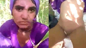 A married woman from a village gets intimate with her boyfriend in an open field