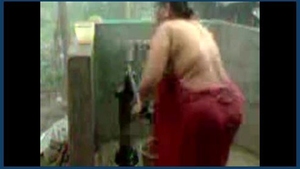 Desi aunty bathes at the well