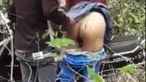 Couple enjoys sex in the woods near a park