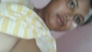 A seductive Indian housewife engages in explicit sexual activity