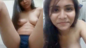 A South Asian woman masturbates in a sensual video using her fingers