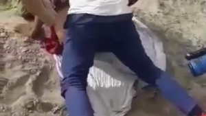 A Rajasthani woman engages in sexual activity with two men in an outdoor setting