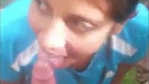Cute desi girl gives blowjob to her boyfriend's cock in outdoor setting