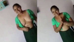 Indian aunt reveals her large breasts to a customer