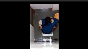 Indian girl changes pad in bathroom