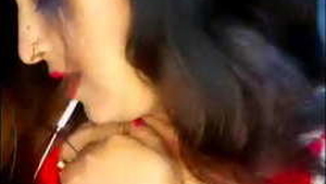 Indian mature woman with large breasts sensually dances