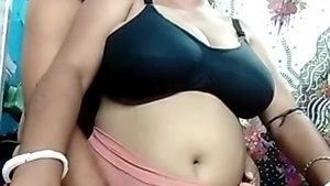 After giving oral pleasure, an auntie gets fucked doggy style by her husband