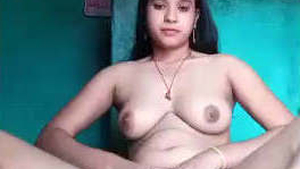 A beautiful young woman records herself in an attractive manner