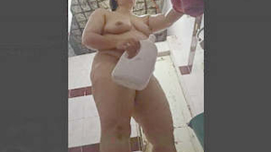 Indian mature woman secretly watched while taking a bath