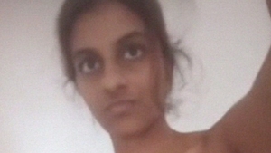 Tamil girl goes naked and pleasures herself with her fingers