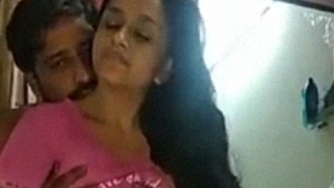 A sensual Indian couple indulges in foreplay and lovemaking in a steamy video