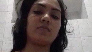 Indian bhabhi in the bathroom recording her nude body on camera