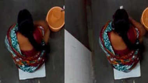 Watch a stunning Indian woman pee and clean herself in a public restroom