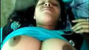 A seductive Indian girl with large breasts gets intimate