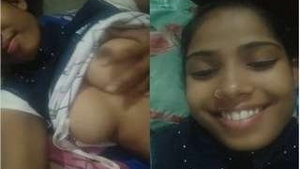 A stunning Indian girl gives a sensual blowjob and flaunts her breasts