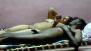 Naked couple enjoys sensual massage on bed after intercourse