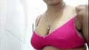 Young woman tapes herself undressed while pleasuring herself