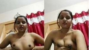 Attractive Indian woman fondles her breasts on camera