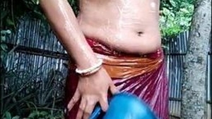 Indian wife bathes outdoors and reveals her breasts