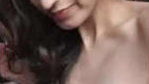 A well-endowed woman indulges in solo pleasure