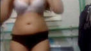 A stunning South Asian woman takes control during a sensual photo shoot