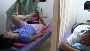 A Japanese wife receives an anal massage with a young man